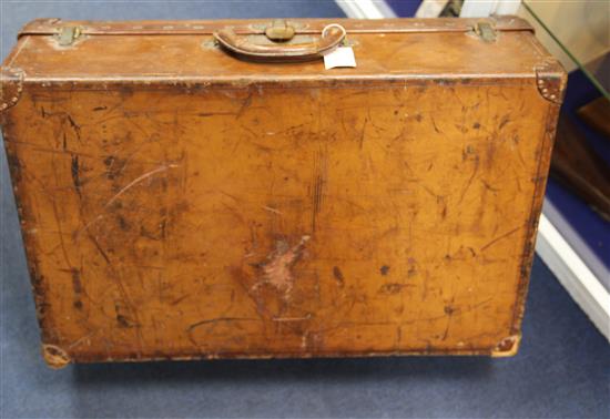 A Louis Vuitton leather suitcase, 26 x 16.5 x 8.5in.